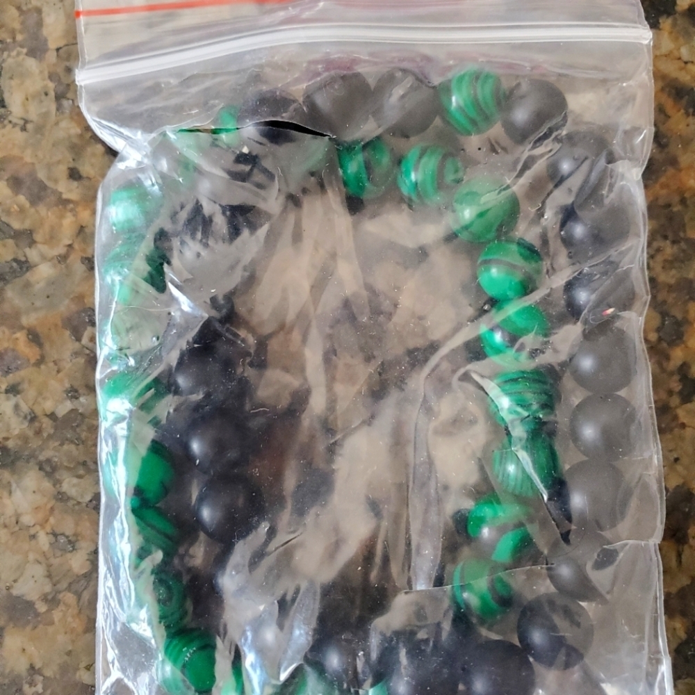 Pair of Green and Black Bracelets